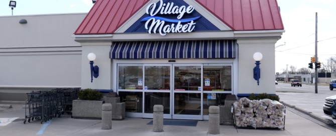 Village Market entrance with custom signage designed by Phillips Sign & Lighting