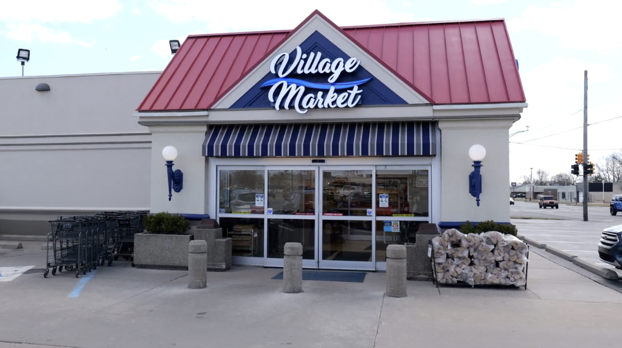 Village Market entrance with custom signage designed by Phillips Sign & Lighting