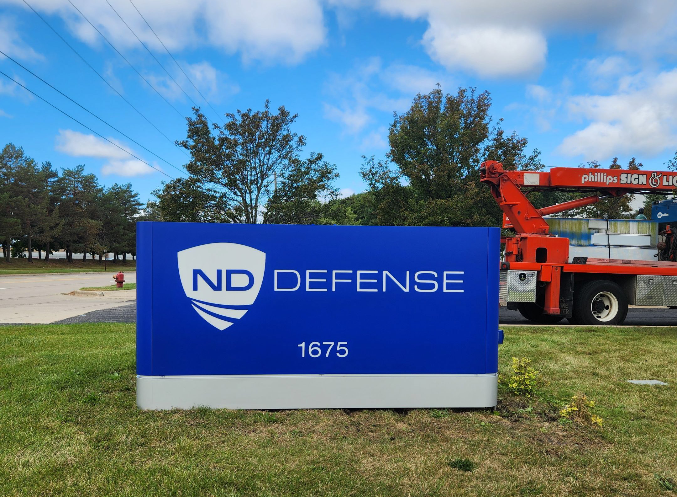 Navistar Defense – Madison Heights – Renovation Navistar Defense (ND) blue monument sign renovation in Madison Heights, MI